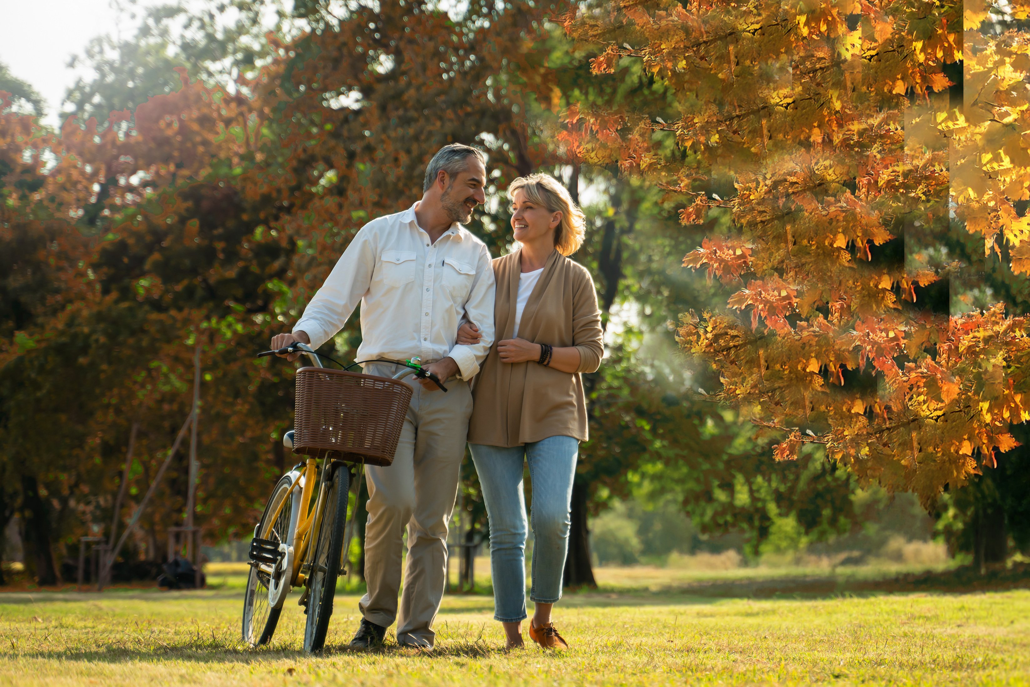 Middle aged couple walking in park